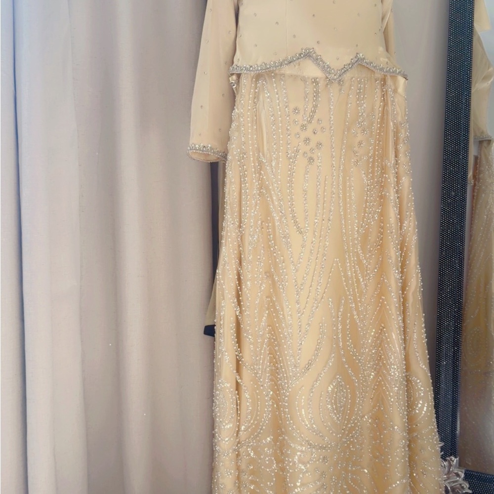Elegant Cream Wedding Dress with Beaded Details